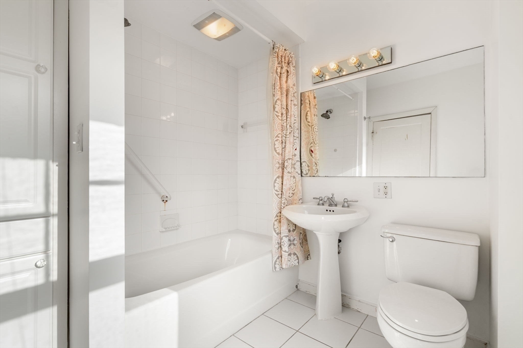 16 Intervale Road Wellesley, MA 02481 - Photo 20 of 24 a bathroom with a sink a toilet and shower
