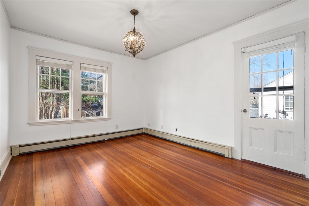 16 Intervale Road Wellesley, MA 02481 - Photo 21 of 24 a view of an empty room with wooden floor and a window