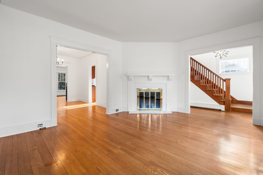 16 Intervale Road Wellesley, MA 02481 - Photo 3 of 24 a view of an empty room with wooden floor and a window