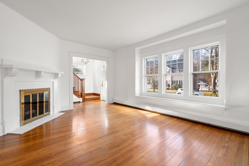 16 Intervale Road Wellesley, MA 02481 - Photo 4 of 24 wooden floor in an empty room with a window