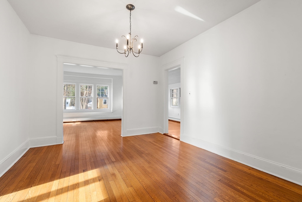 16 Intervale Road Wellesley, MA 02481 - Photo 5 of 24 a view of an empty room with wooden floor and a window
