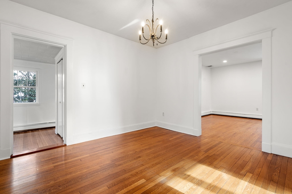 16 Intervale Road Wellesley, MA 02481 - Photo 6 of 24 wooden floor in an empty room with a window