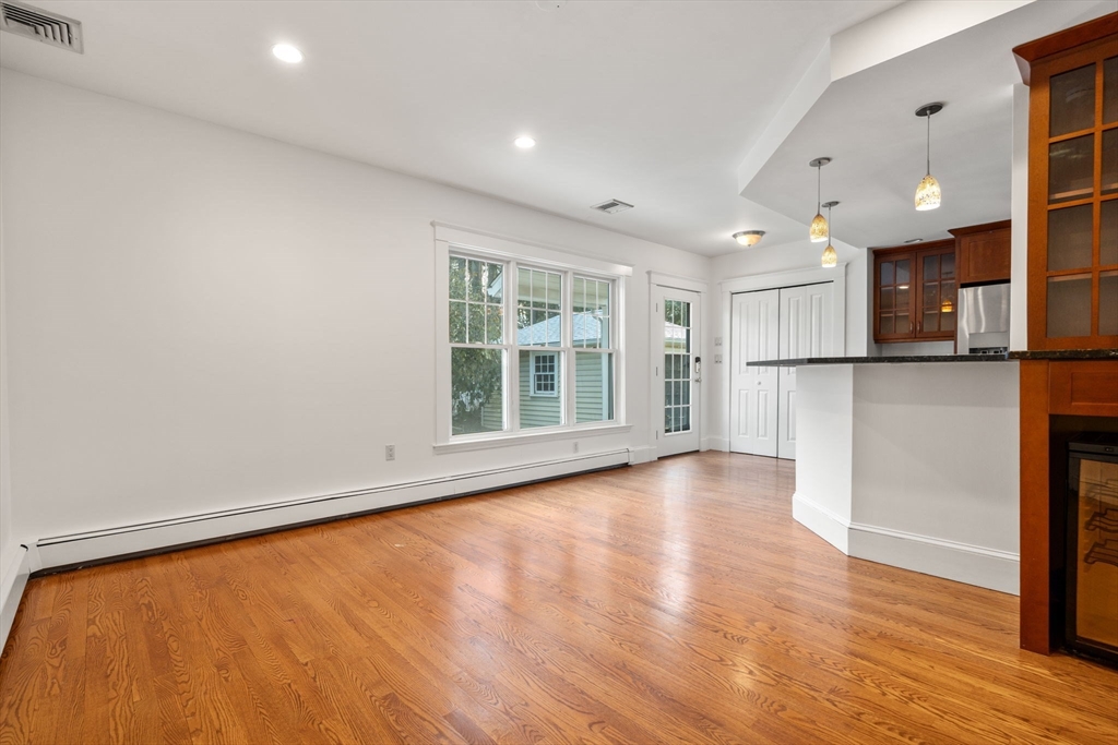 16 Intervale Road Wellesley, MA 02481 - Photo 10 of 24 a view of an empty room with wooden floor and a window