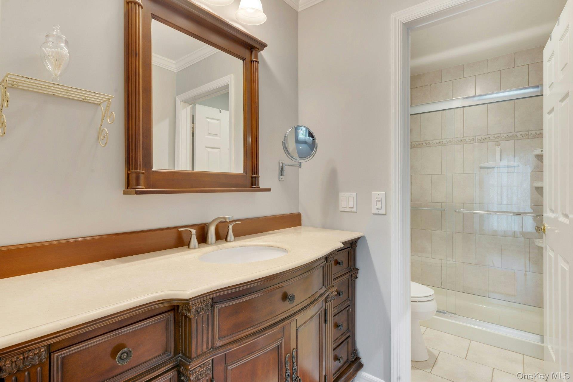104 Glen Drive Ridge, NY 11961 - Photo 22 of 25 a bathroom with a sink and a mirror
