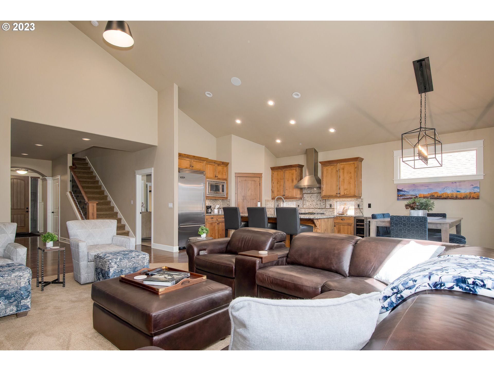 12918 Southwest Sevilla Avenue Portland, OR 97223 - Photo 11 of 44 a living room with furniture and a chandelier