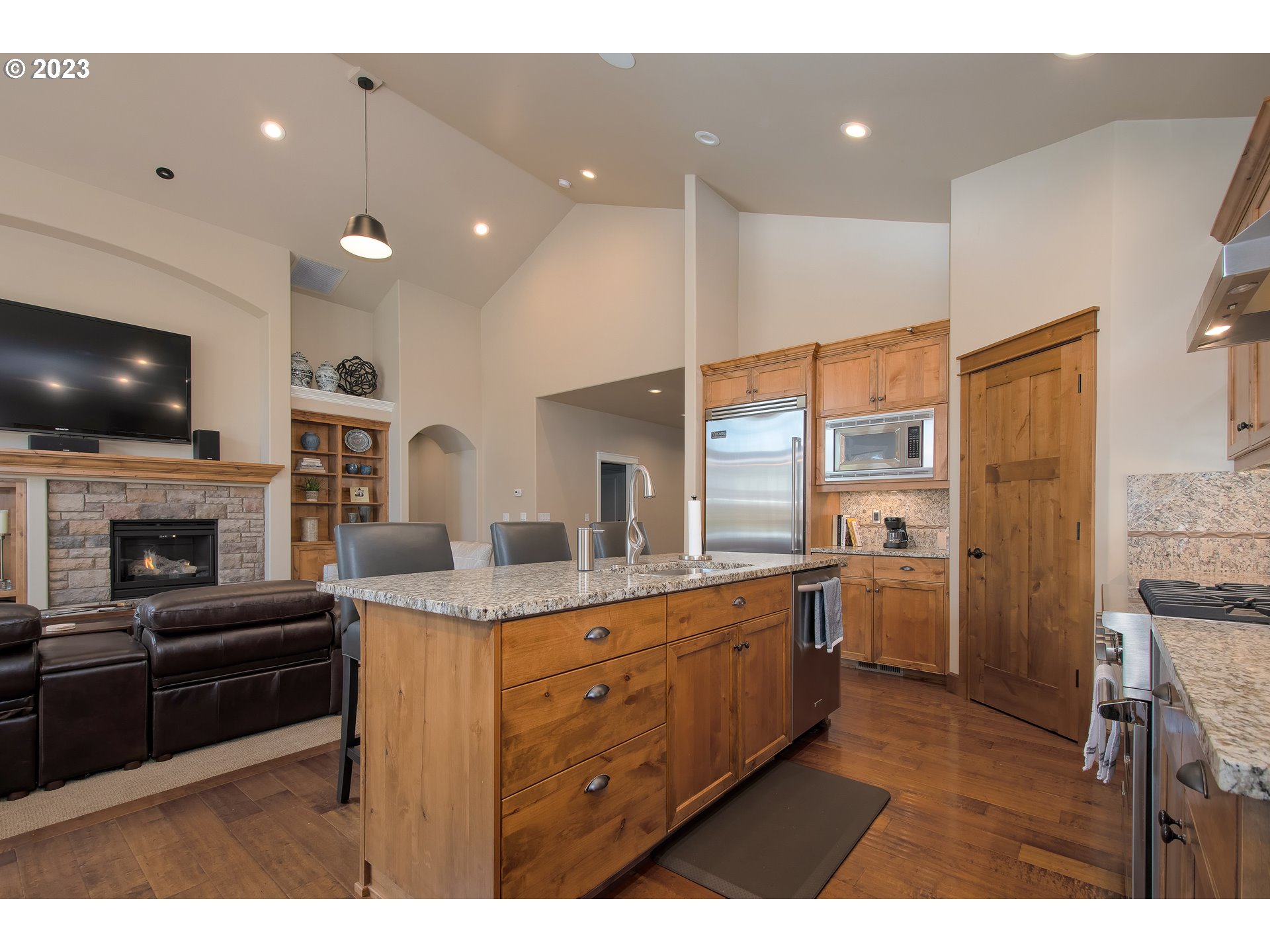 12918 Southwest Sevilla Avenue Portland, OR 97223 - Photo 16 of 44 a kitchen with stainless steel appliances granite countertop a sink a stove and a refrigerator