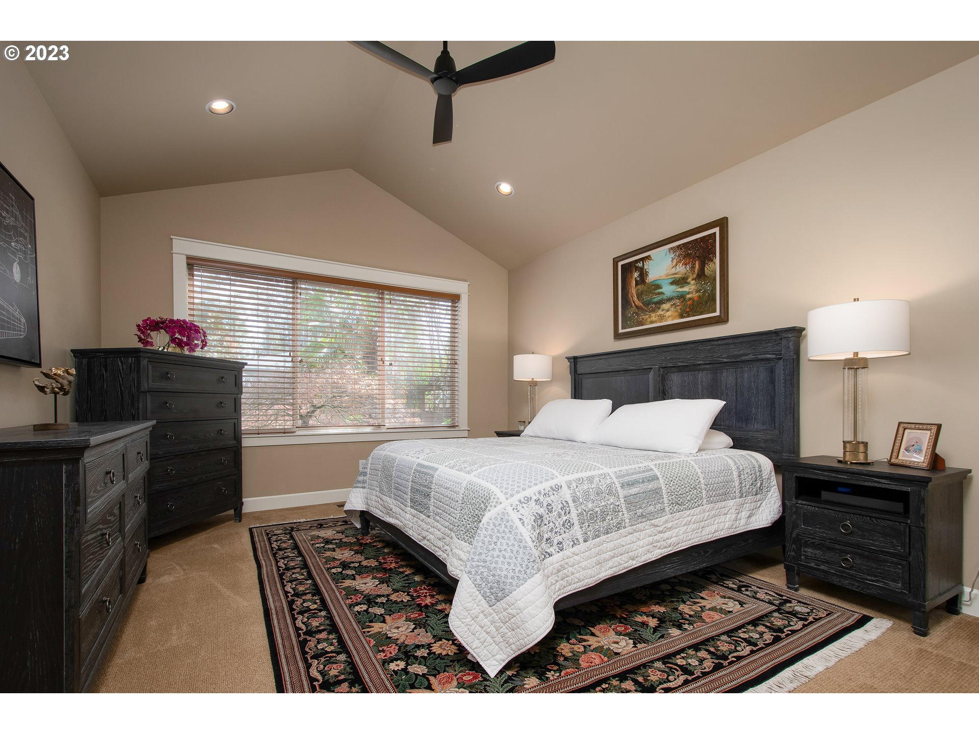 12918 Southwest Sevilla Avenue Portland, OR 97223 - Photo 21 of 44 a bedroom with a bed window and a table