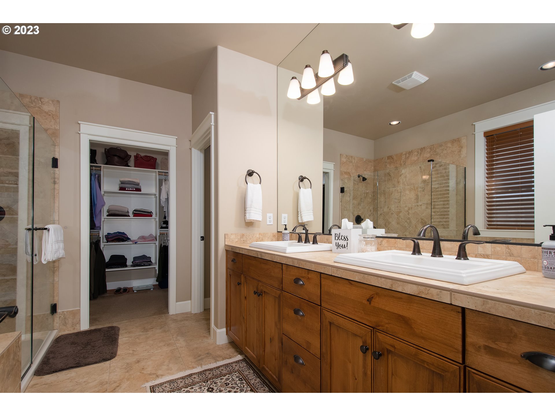 12918 Southwest Sevilla Avenue Portland, OR 97223 - Photo 23 of 44 a bathroom with a sink double vanity