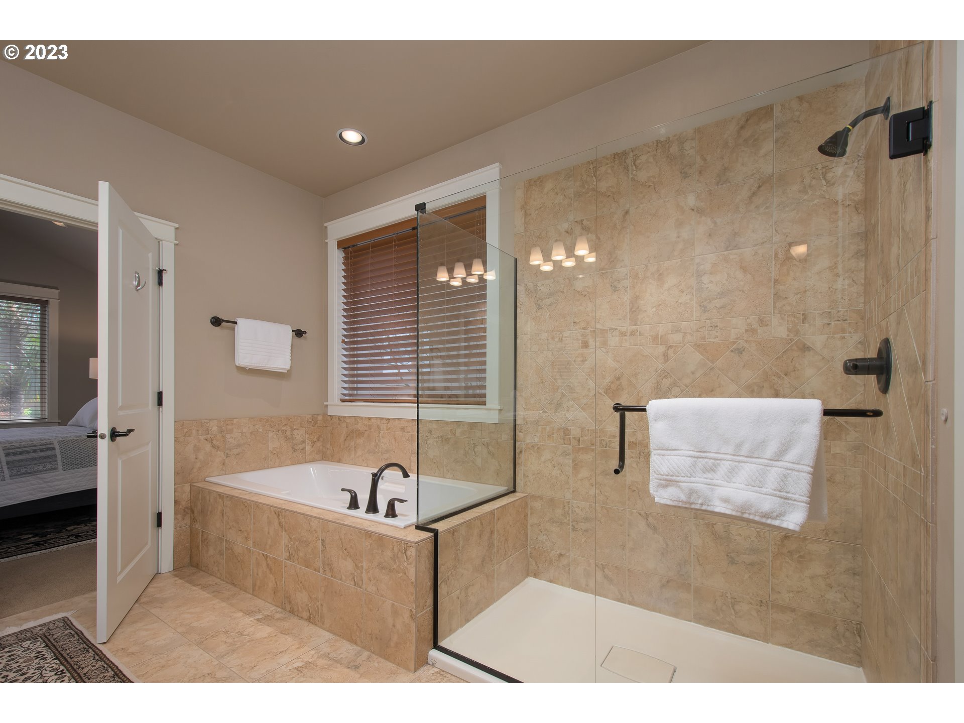 12918 Southwest Sevilla Avenue Portland, OR 97223 - Photo 24 of 44 a bathroom with a tub a sink and a shower