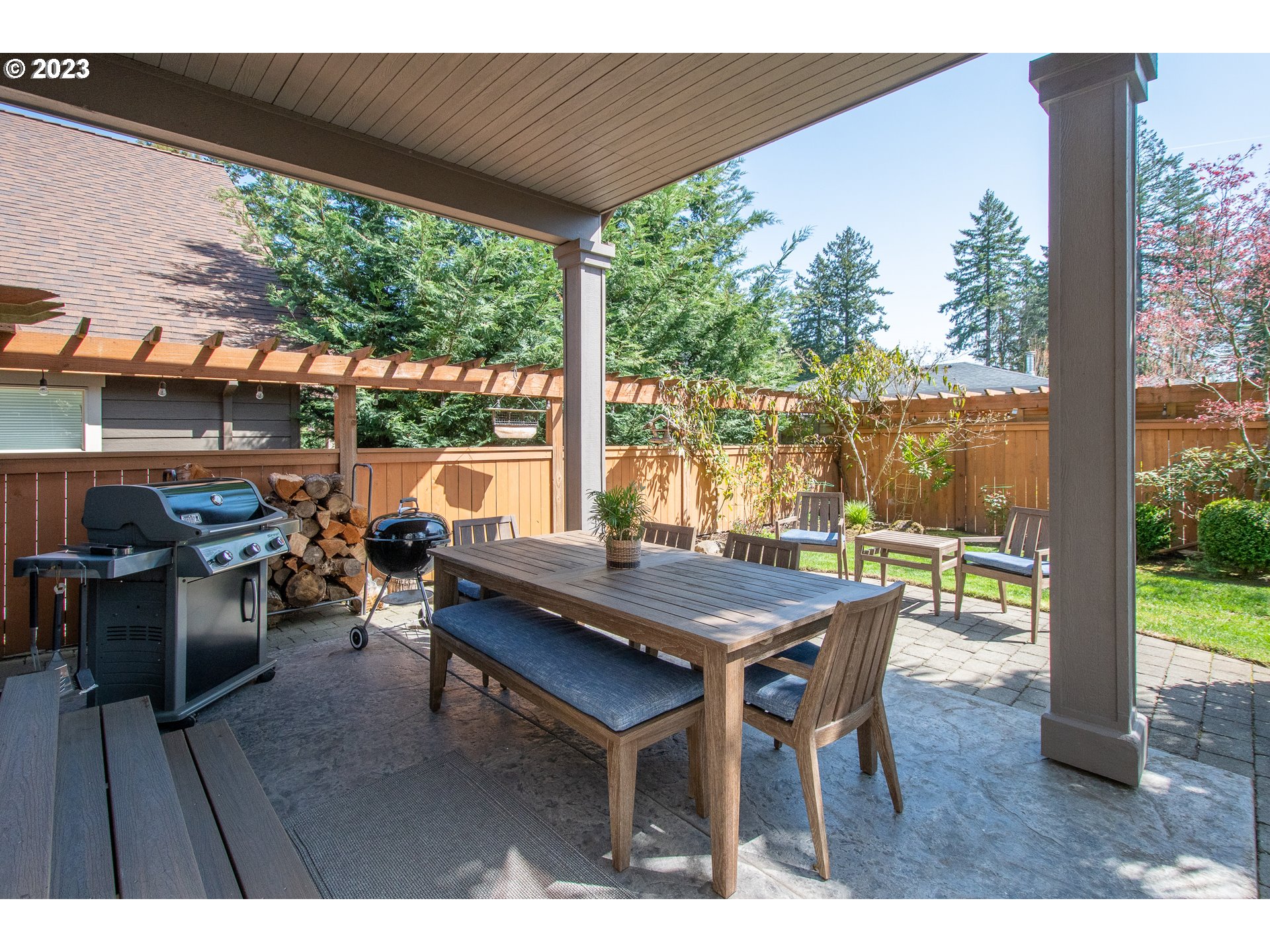 12918 Southwest Sevilla Avenue Portland, OR 97223 - Photo 34 of 44 a view of a patio with table and chairs