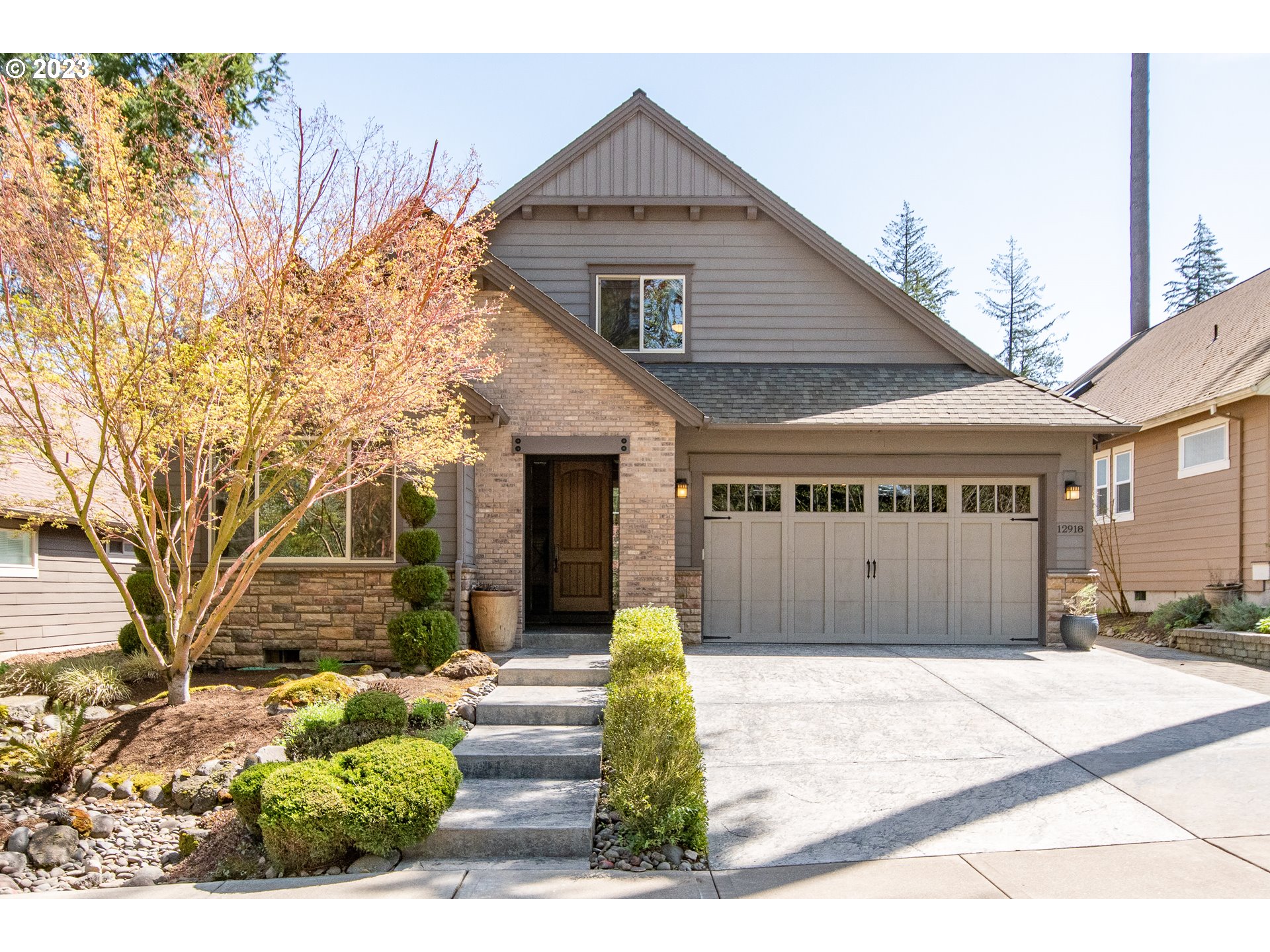 12918 Southwest Sevilla Avenue Portland, OR 97223 - Photo 41 of 44 a front view of a house with a yard