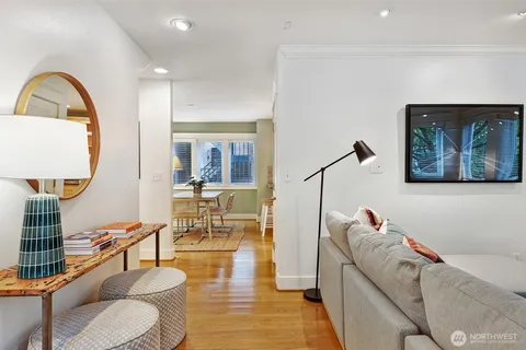 a living room with furniture and a mirror