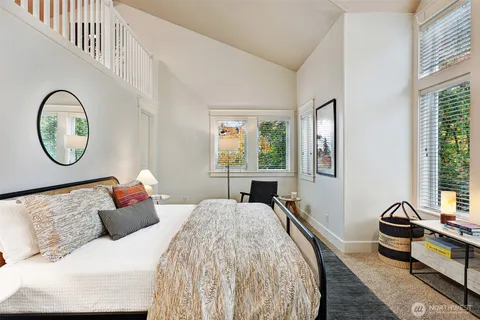 a bedroom with bed and a window