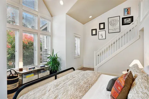 a bedroom with bed and a window