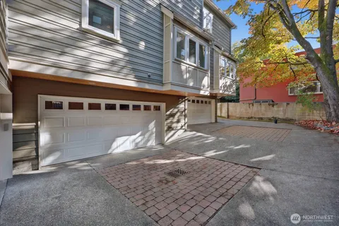 a view of a backyard with a tree
