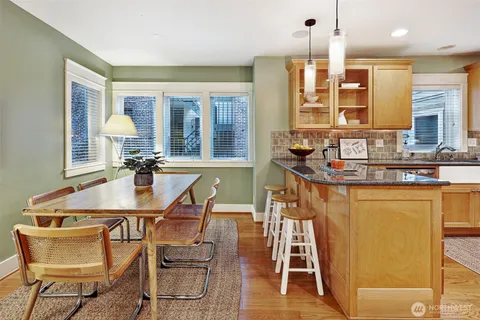 a dining room with furniture and window