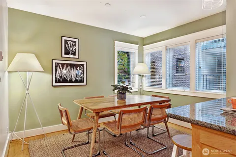a dining room with furniture and window