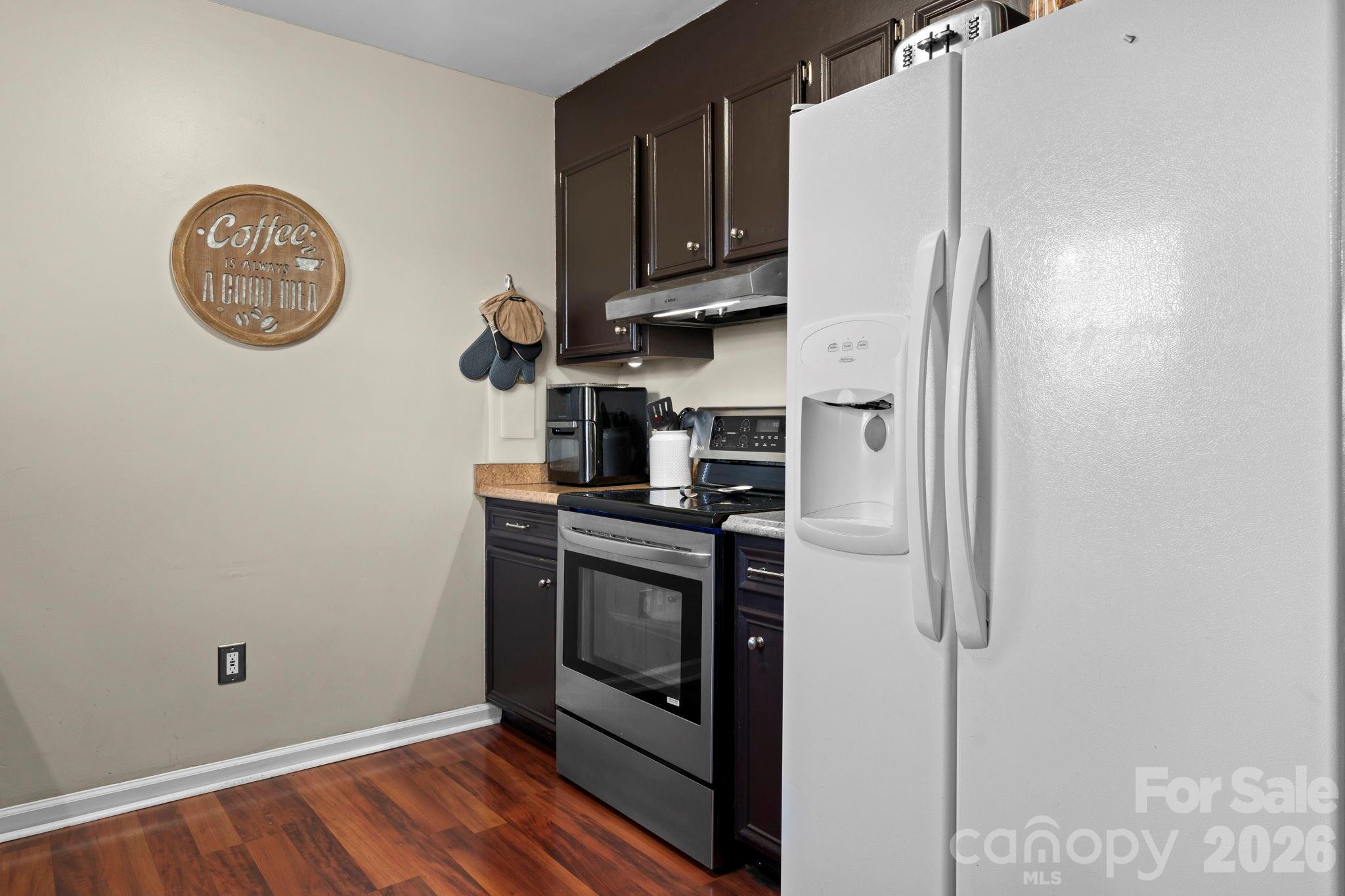 5750 Ellenwood Road Granite Falls, NC 28630 - Photo 17 of 38 a kitchen with stainless steel appliances granite countertop a refrigerator and a stove top oven