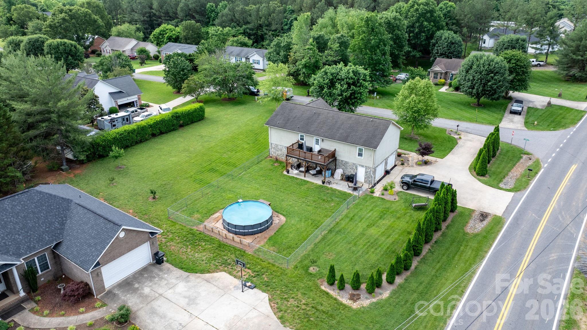 5750 Ellenwood Road Granite Falls, NC 28630 - Photo 27 of 38 a view of a table and chairs in backyard