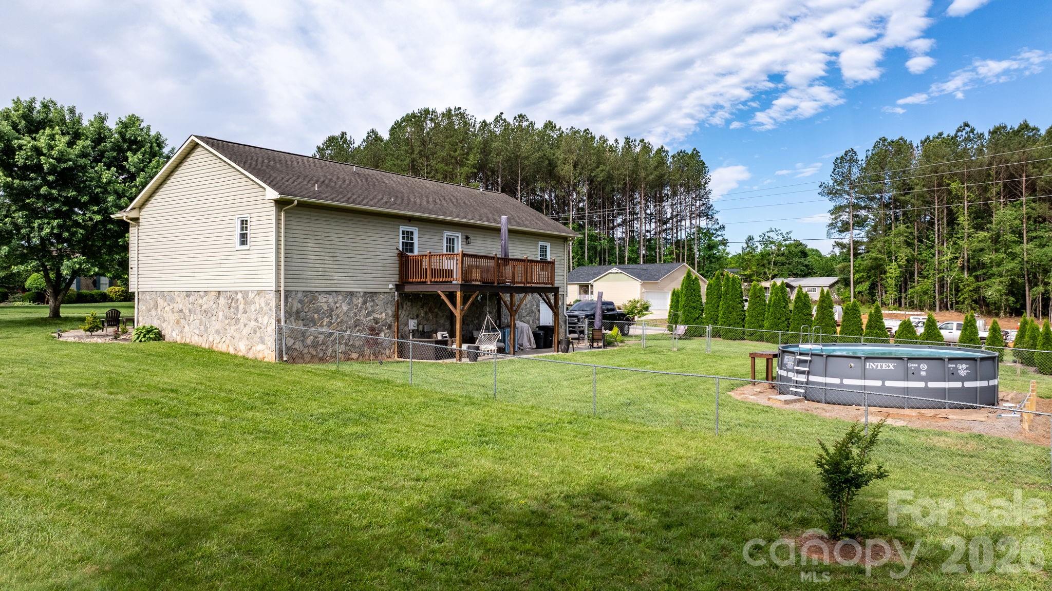 5750 Ellenwood Road Granite Falls, NC 28630 - Photo 28 of 38 a view of a house with backyard and garden