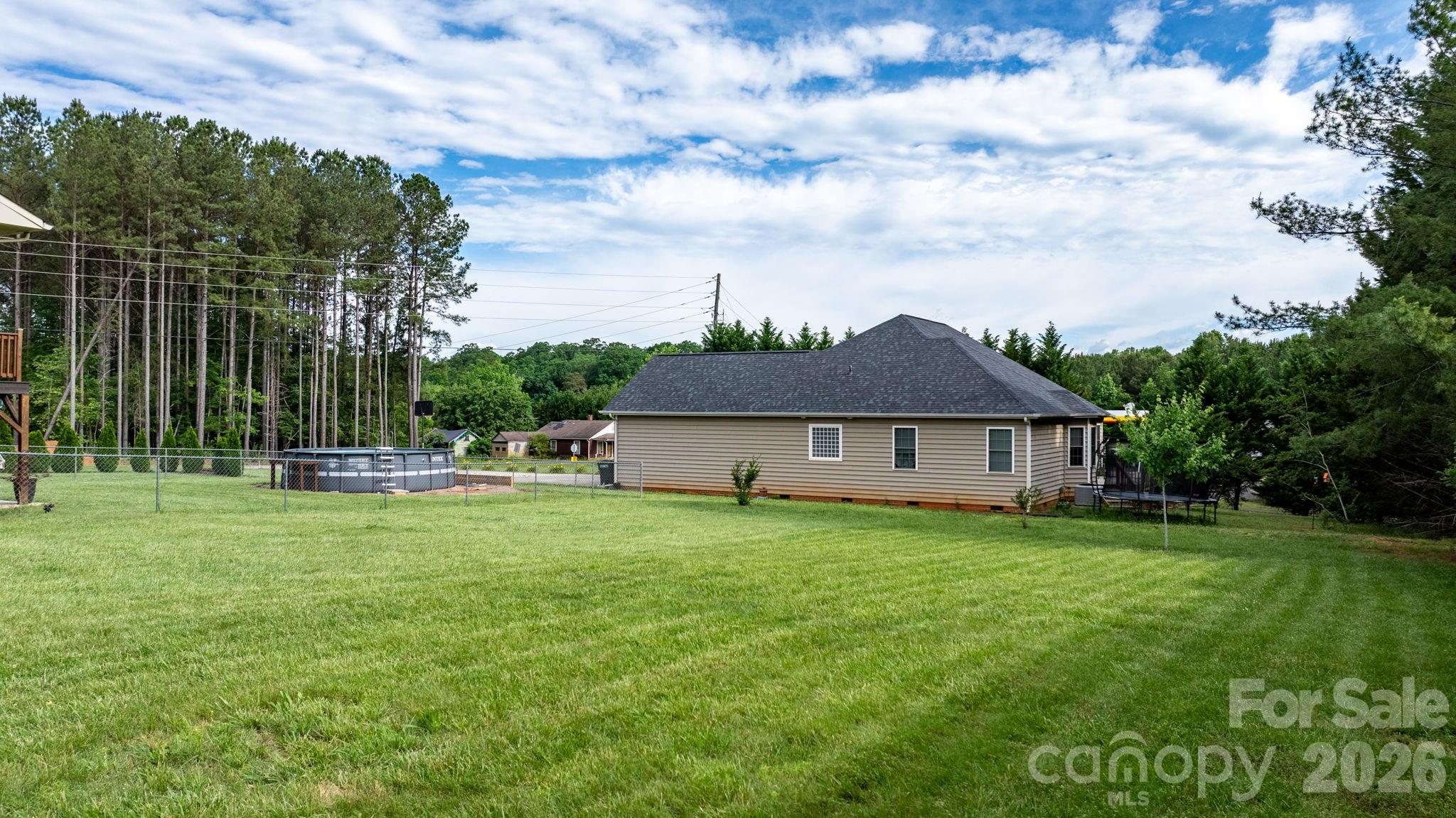 5750 Ellenwood Road Granite Falls, NC 28630 - Photo 29 of 38 a house view with a garden space