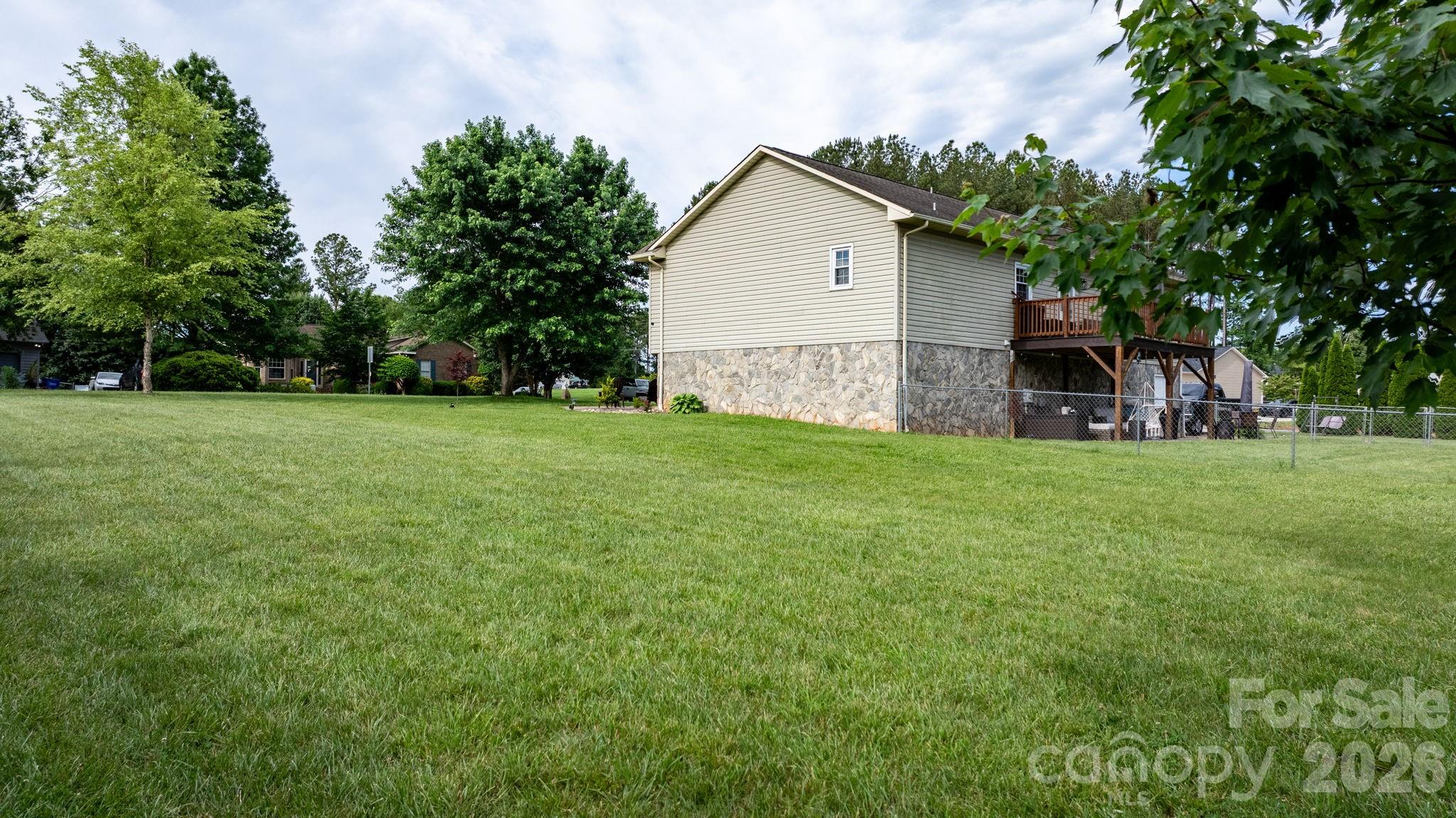 5750 Ellenwood Road Granite Falls, NC 28630 - Photo 34 of 38 a view of a house with a yard