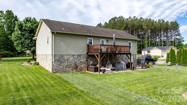 an aerial view of a house with garden space windows and outdoor seating