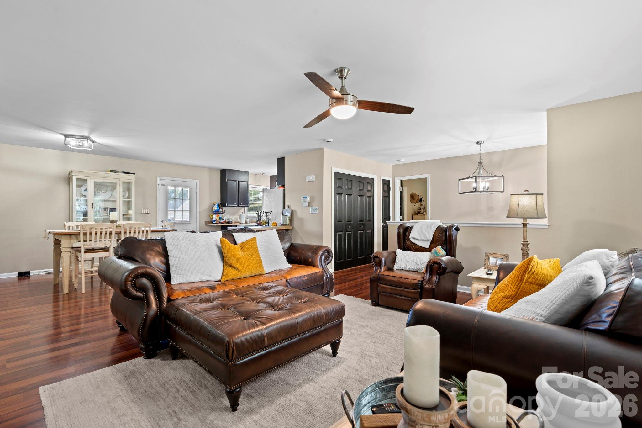 5750 Ellenwood Road Granite Falls, NC 28630 - Photo 7 of 38 a living room with furniture ceiling fan and a wooden floor