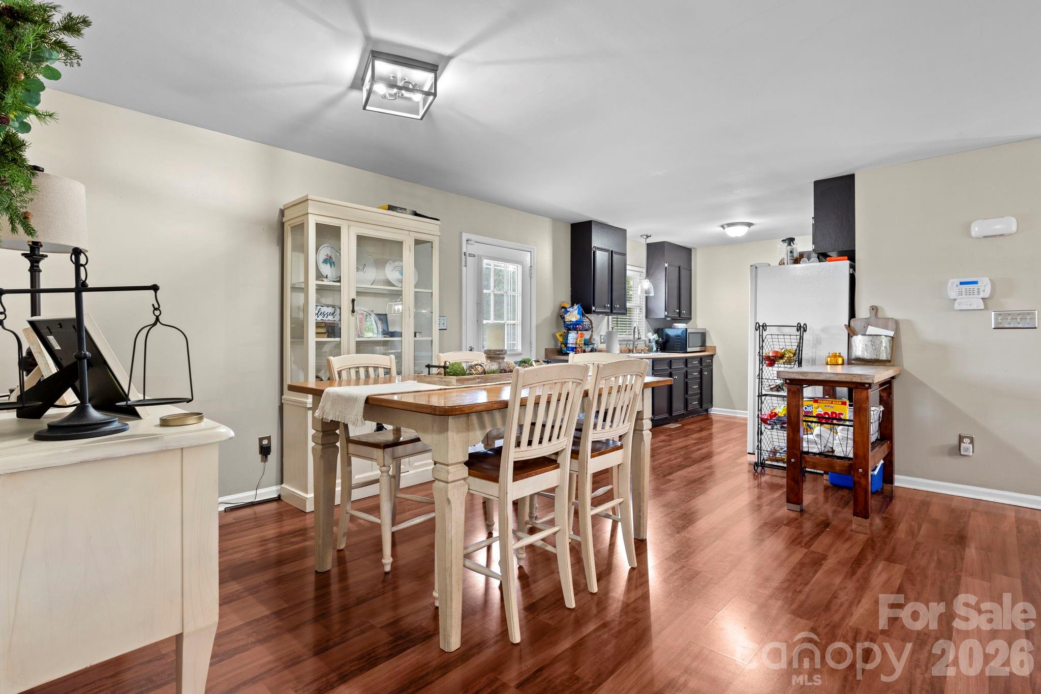 5750 Ellenwood Road Granite Falls, NC 28630 - Photo 9 of 38 a view of a dining room with furniture and wooden floor