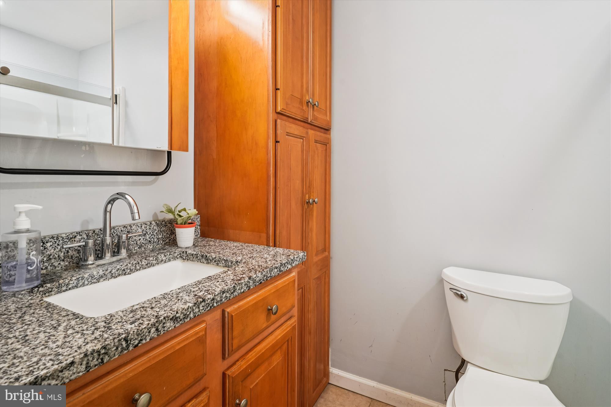 138 Courthouse Road Stafford, VA 22554 - Photo 13 of 29 a bathroom with a granite countertop toilet sink and mirror