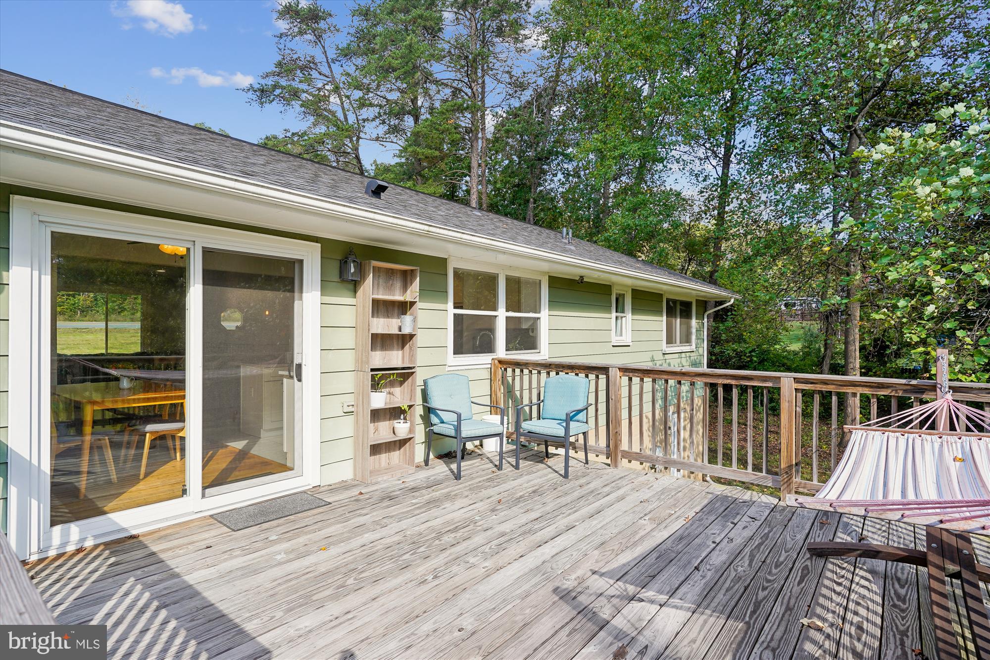 138 Courthouse Road Stafford, VA 22554 - Photo 8 of 29 a view of a deck with table and chairs with wooden floor and fence