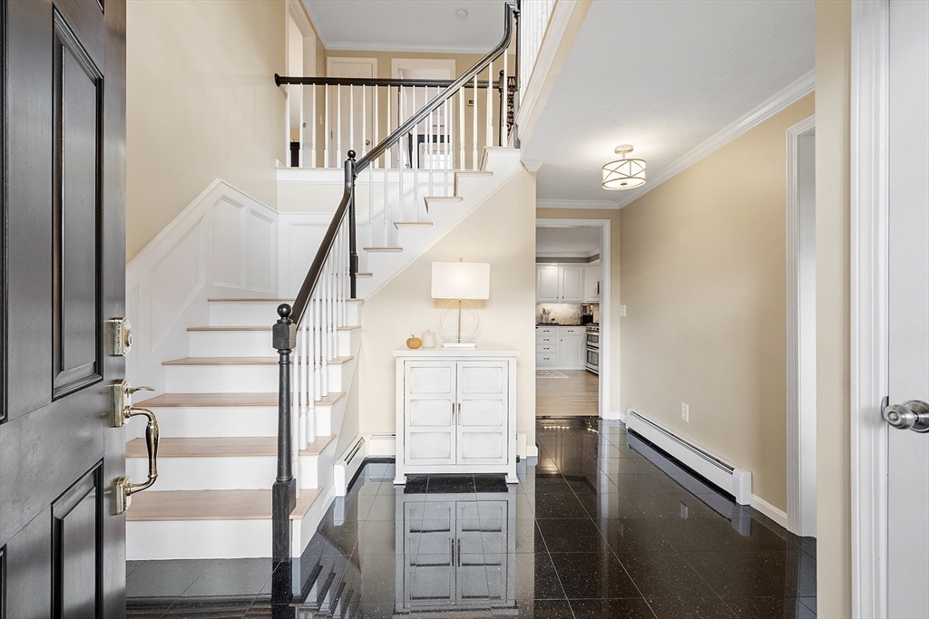 3 Baldwin Road Westford, MA 01886 - Photo 5 of 42 a view of entryway and hall with wooden floor