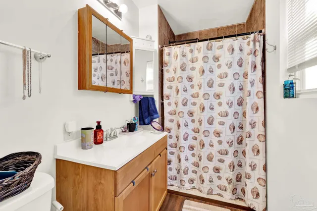 a kitchen with a sink and a refrigerator