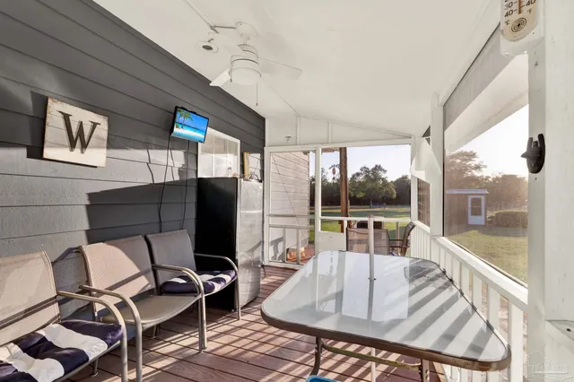 a living room with patio furniture