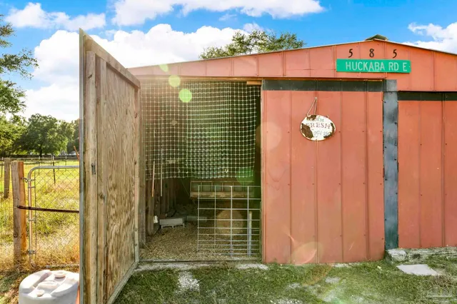 a view of a chairs and table in a balcony