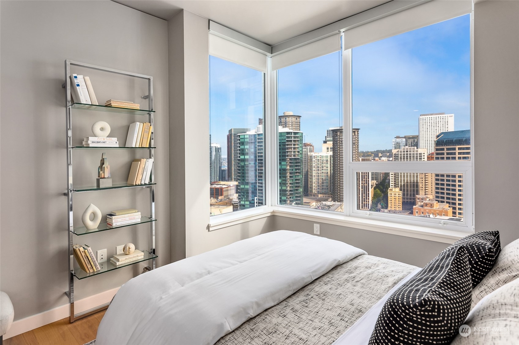 121 Stewart Street, Unit 1701 Seattle, WA 98101 - Photo 14 of 15 a bedroom with a large window and a bed