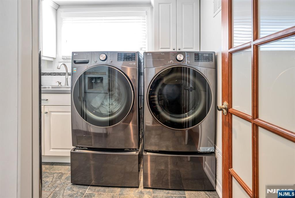 84 Bogerts Mill Road Harrington Park, NJ 07640 - Photo 16 of 47 a kitchen with a washer and dryer