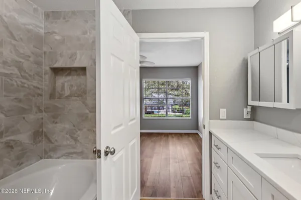 a bathroom with a sink and a bathtub