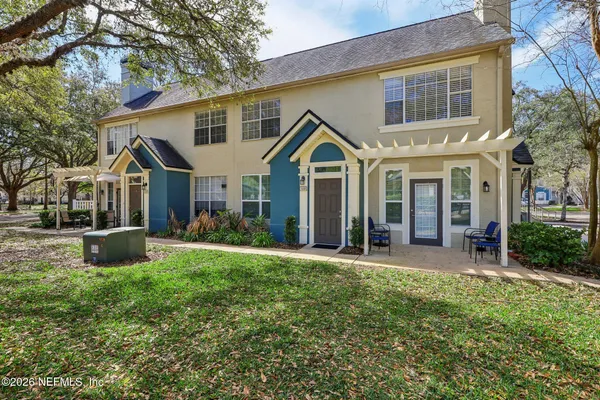 a front view of a house with a yard and porch