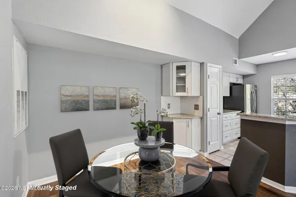 a dining room with furniture and window