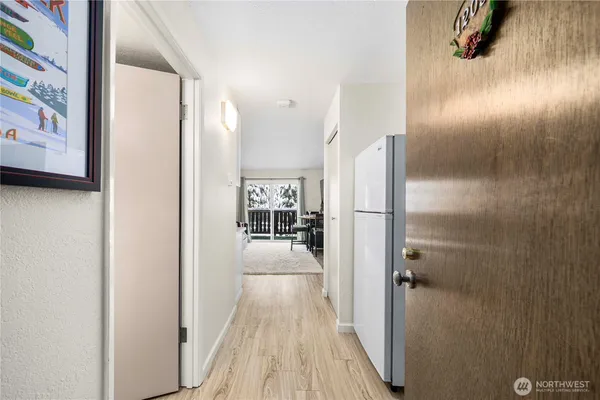 a view of a living room with a wooden floor