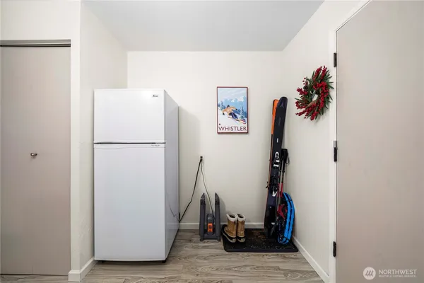 a view of a storage & utility room with two washing machine