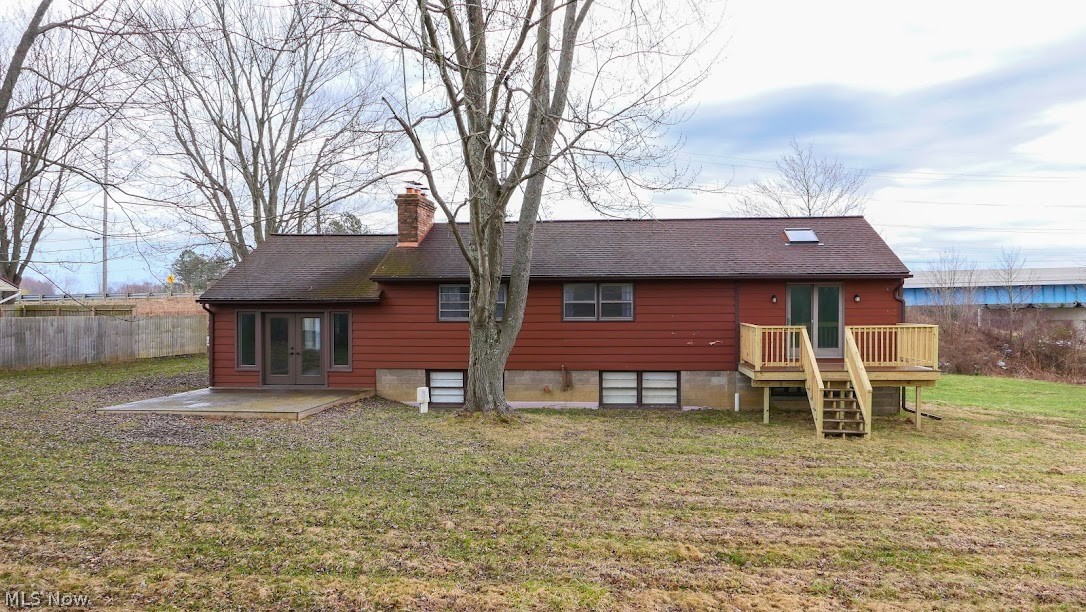 3235 Chapel Road Ashtabula, OH 44004 - Photo 11 of 13 Back of property featuring a lawn, french doors, and a deck