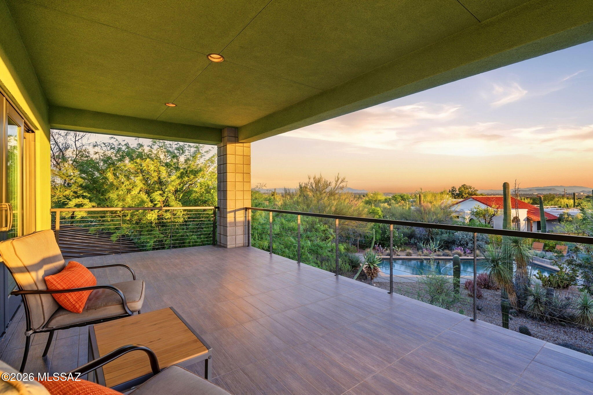 5070 North Valley View Road Tucson, AZ 85718 - Photo 25 of 51 a view of a chairs and table in patio with wooden floor