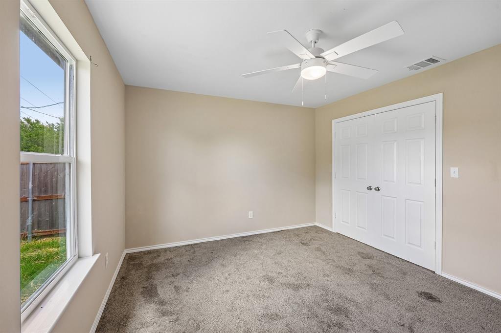 433 Whitney Court Rio Vista, TX 76093 - Photo 18 of 27 a view of a livingroom with a ceiling fan and window