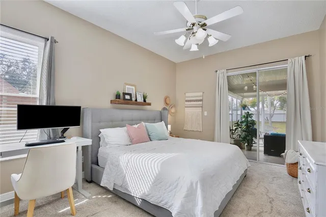 a bedroom with a bed and a chair