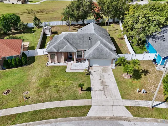 an aerial view of residential houses with outdoor space