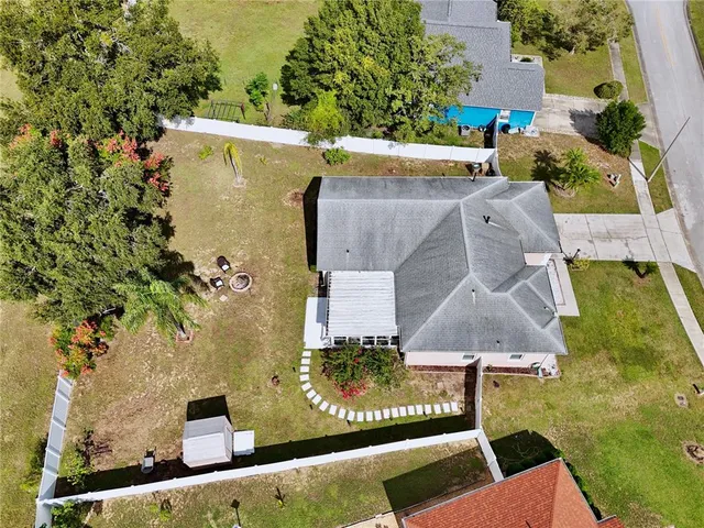 an aerial view of residential houses with outdoor space