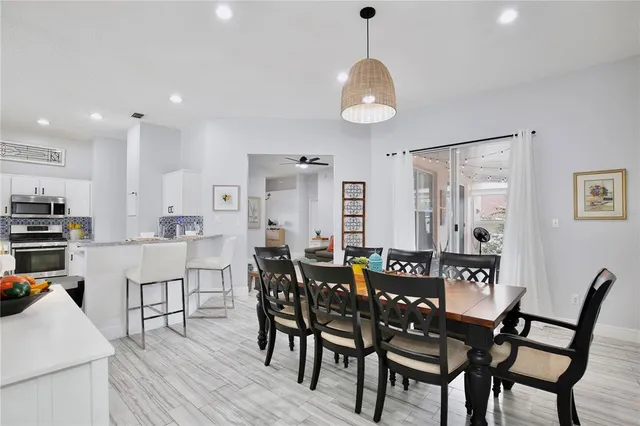 a kitchen with stainless steel appliances a stove a refrigerator and a refrigerator