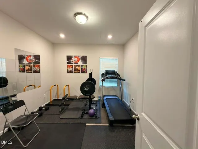 a room with furniture and gym equipment